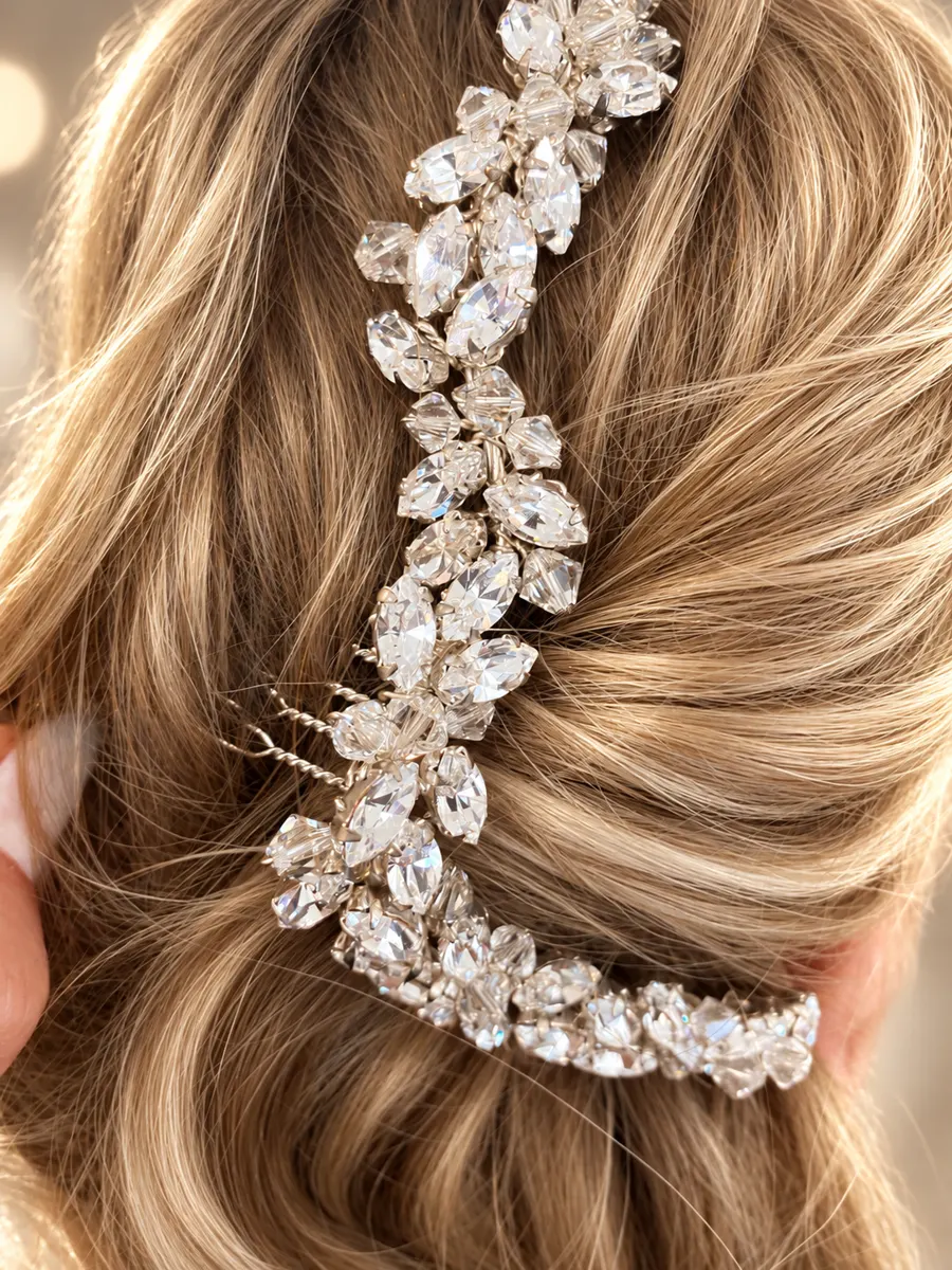 Blonde bridal style with crystal hairpiece